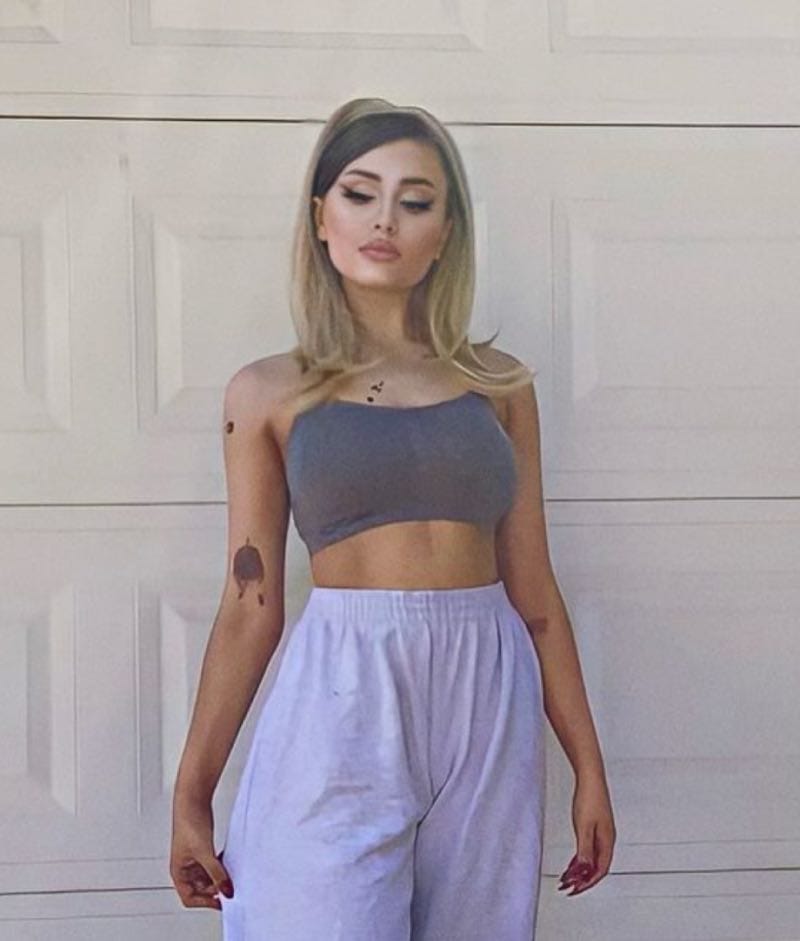 Paige in grey outfit