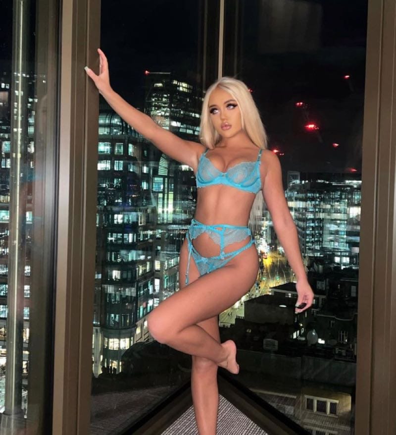 Sexy babe in front of window