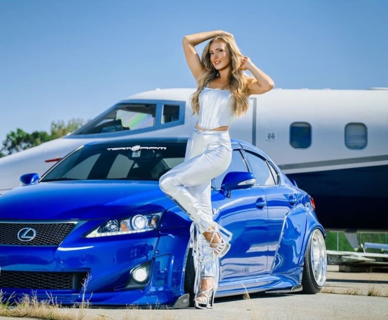 Olga in front of car