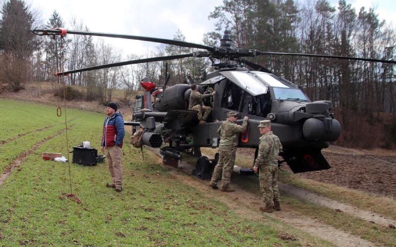 Personell working on appache helicopter