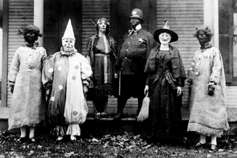 Family picture with people wearing scary clothes