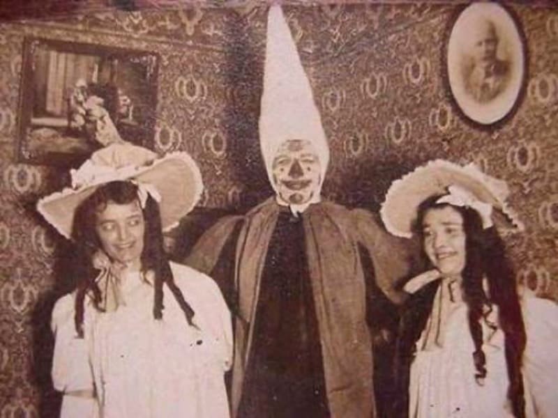 Man with 2 women in creepy clothes