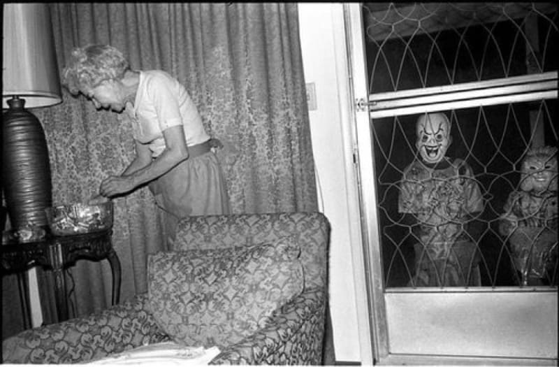 Kids outside of window in creepy costumes