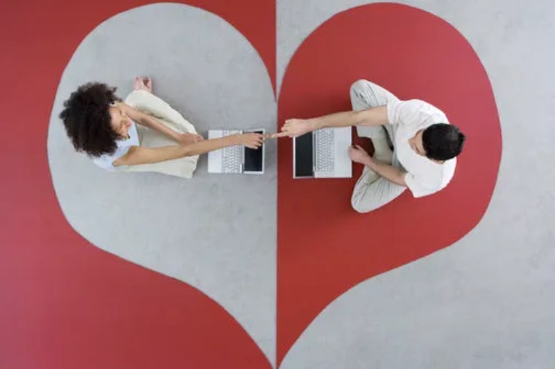 People sitting on floor in heart shape