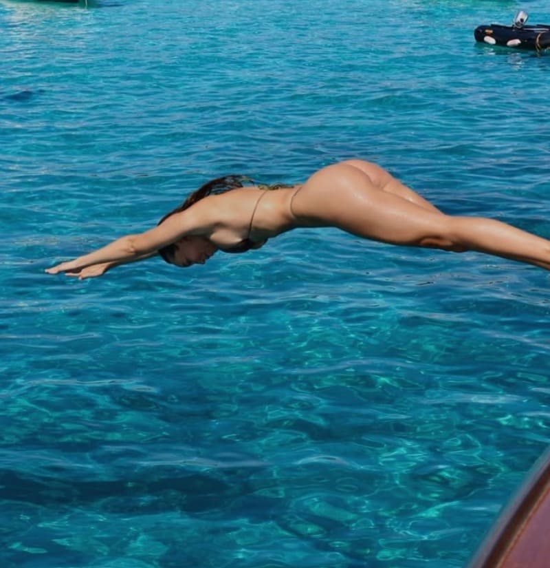 Hot chick jumping in water