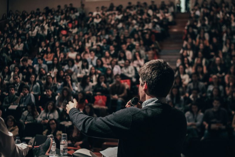 Man in front of crowd Command respect