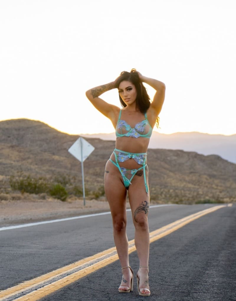 Babe in green lingerie on the middle of the road