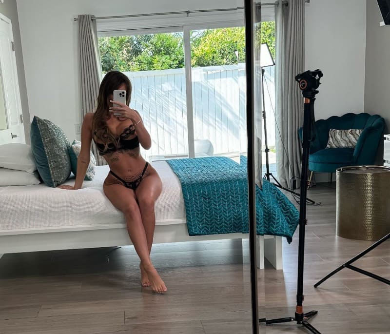 Kiki on bed in lingerie