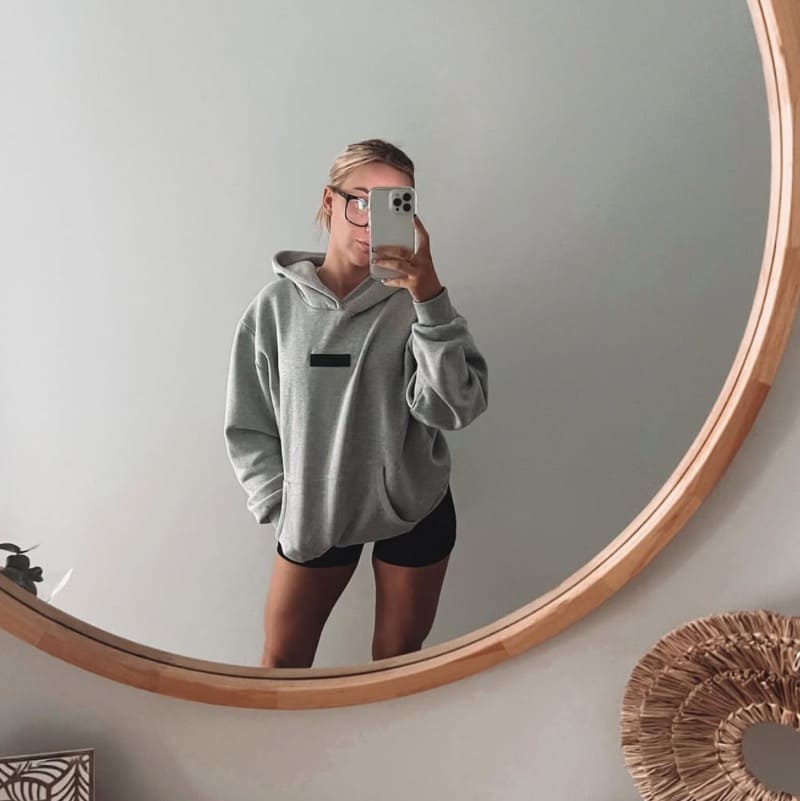 Steph in grey hoody and bootie shorts