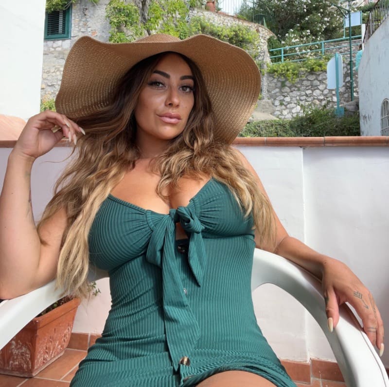 Babe with massive tits in green
