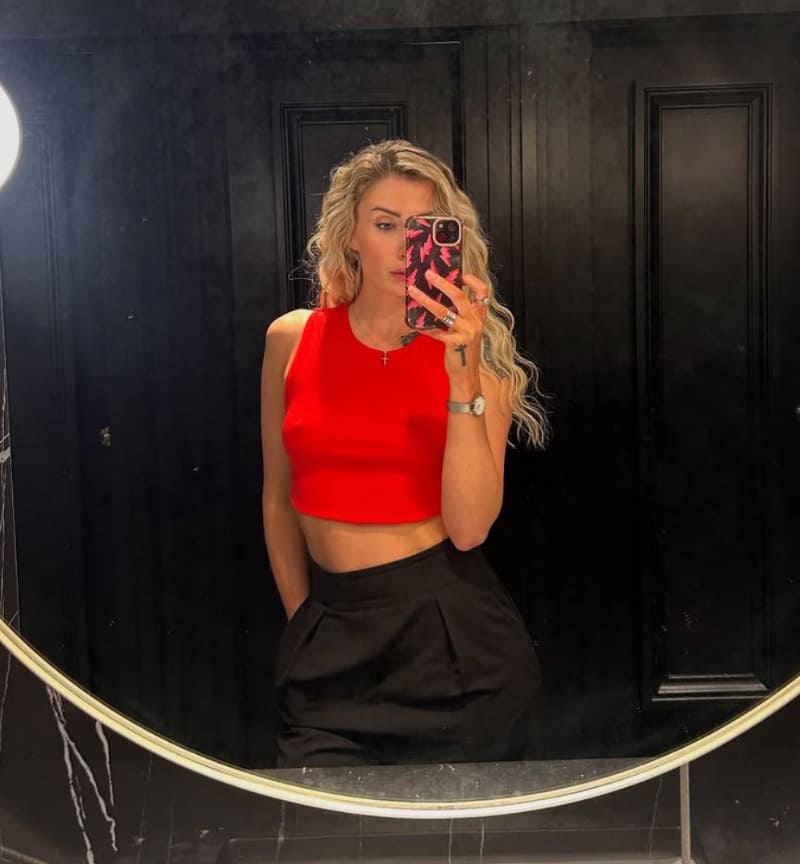 Tosh shows off sexy tits in red top
