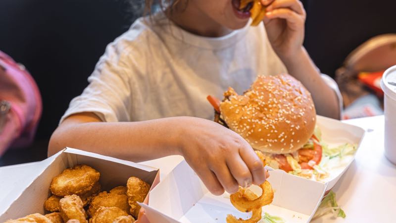 Kid Eating Junk Food