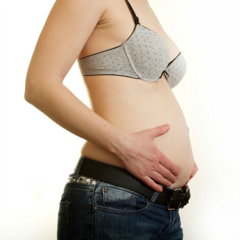 Woman holding stomach