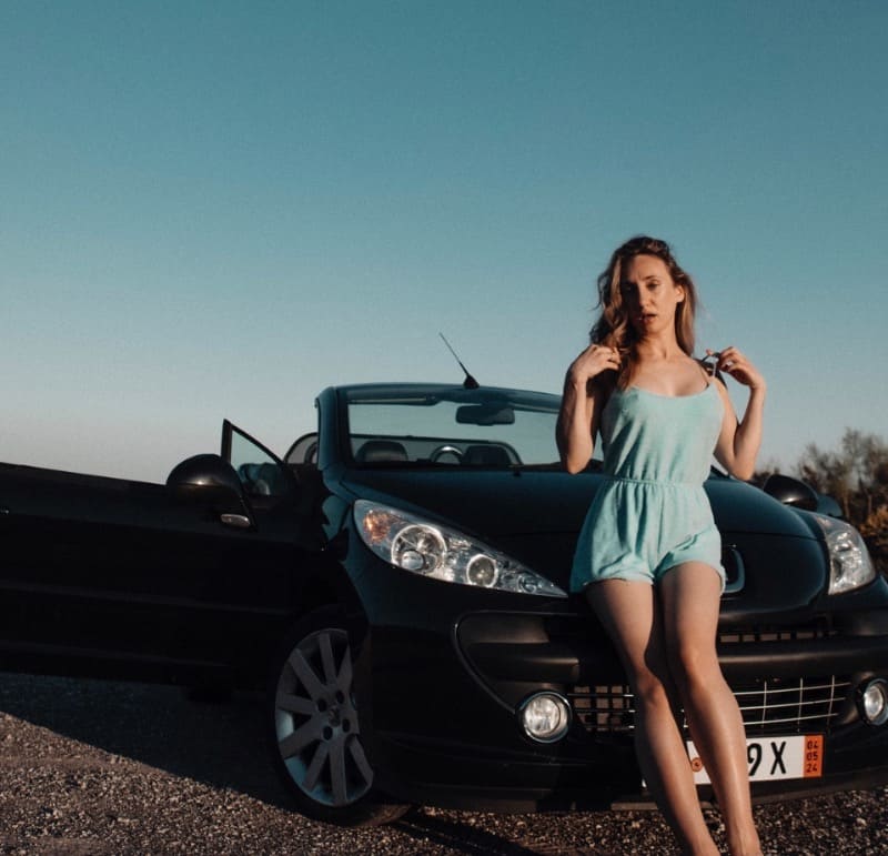 Luna on car in sexy dress