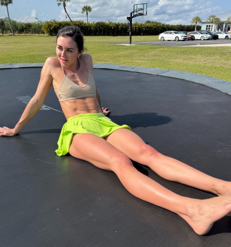 Bryce with sixpack on trampoline