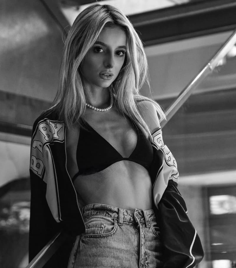 Natalie in sexy outfit with bra