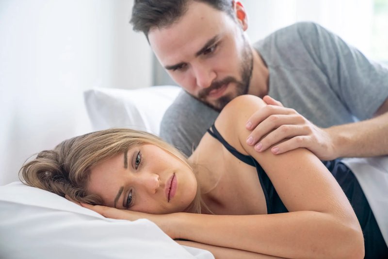 Man in bed with woman Quiet Quitting 