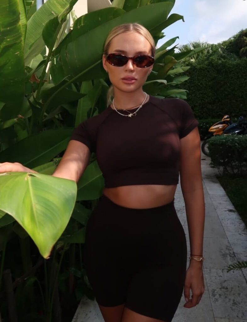 Babe next to plant
