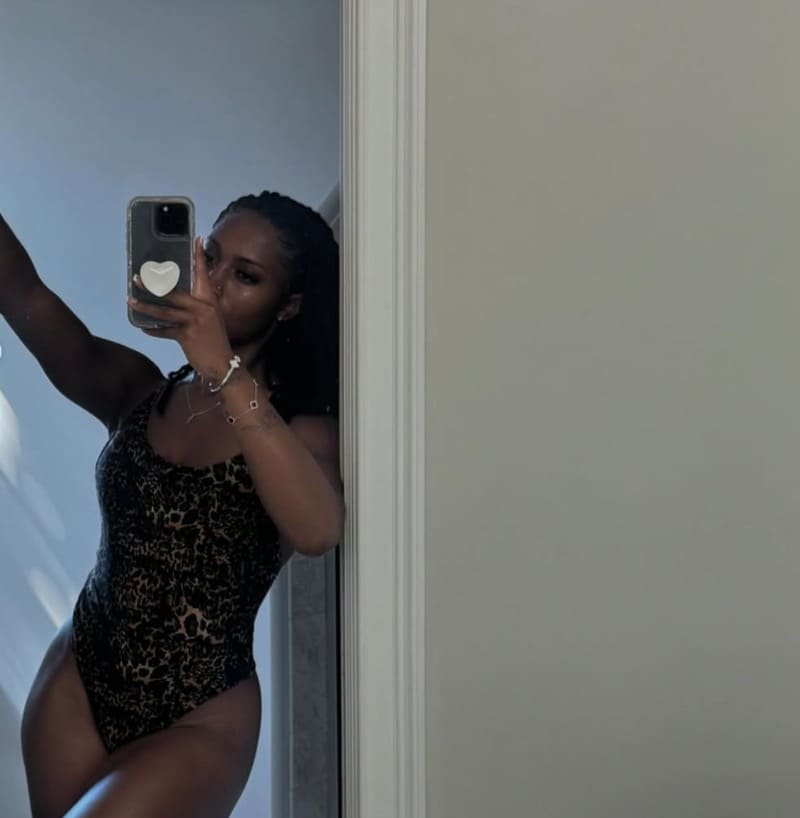 Babe leaning on door