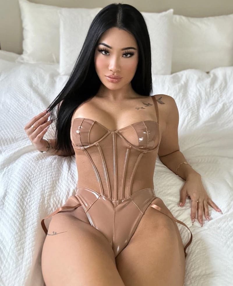 Sexy brunette in beige lingerie with big tits