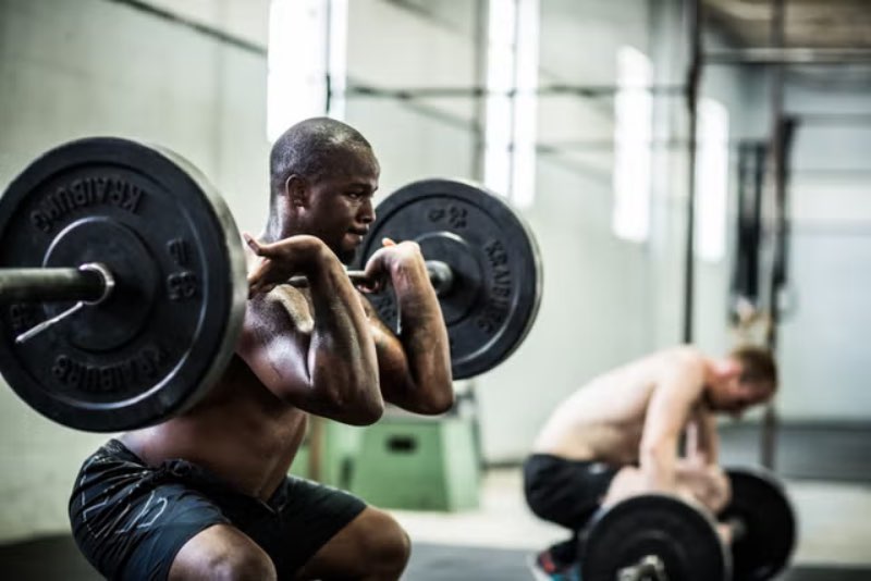 Person lifting weights to get muscle growth