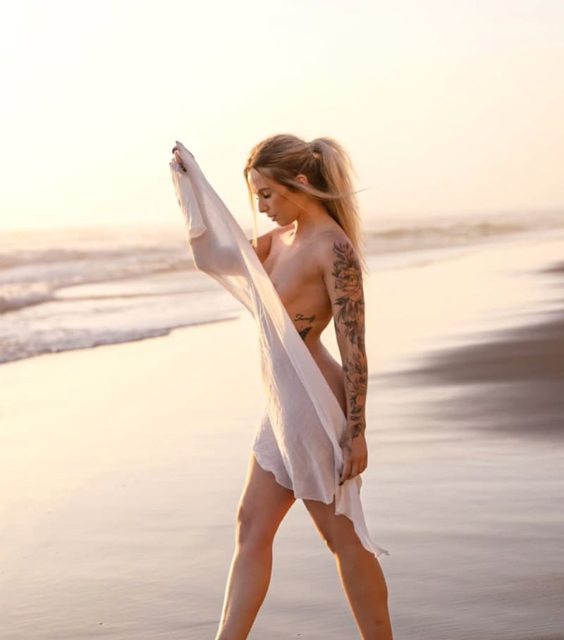 Blonde babe nude on beach