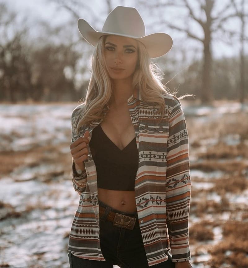 Blonde cowgirl outside