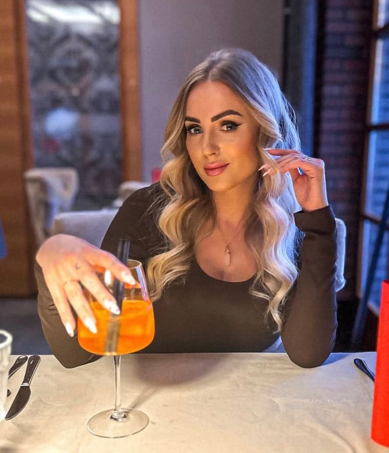 Sexy blonde drinking a cocktail