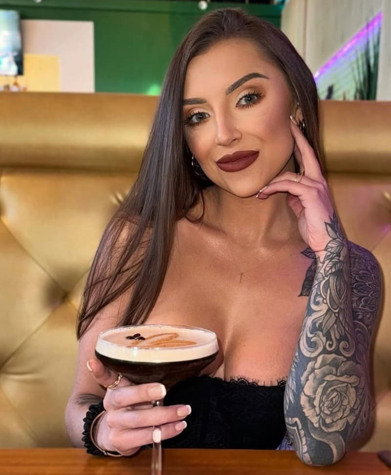 Sexy brunette in tight top with big cleavage