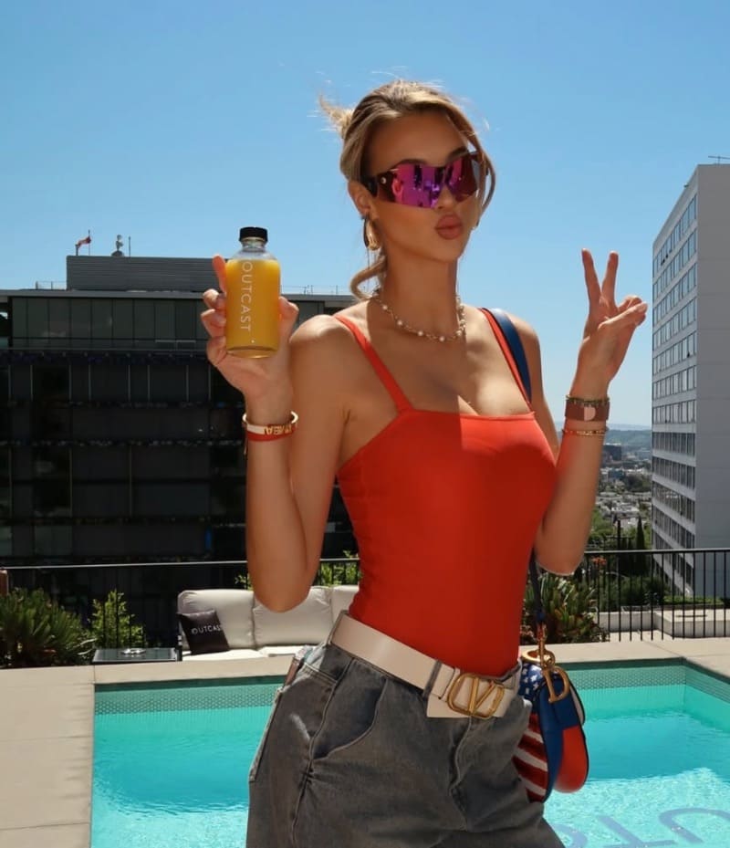 Babe with red top next to pool