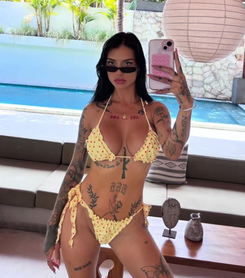 Sexy brunette in yellow bikini