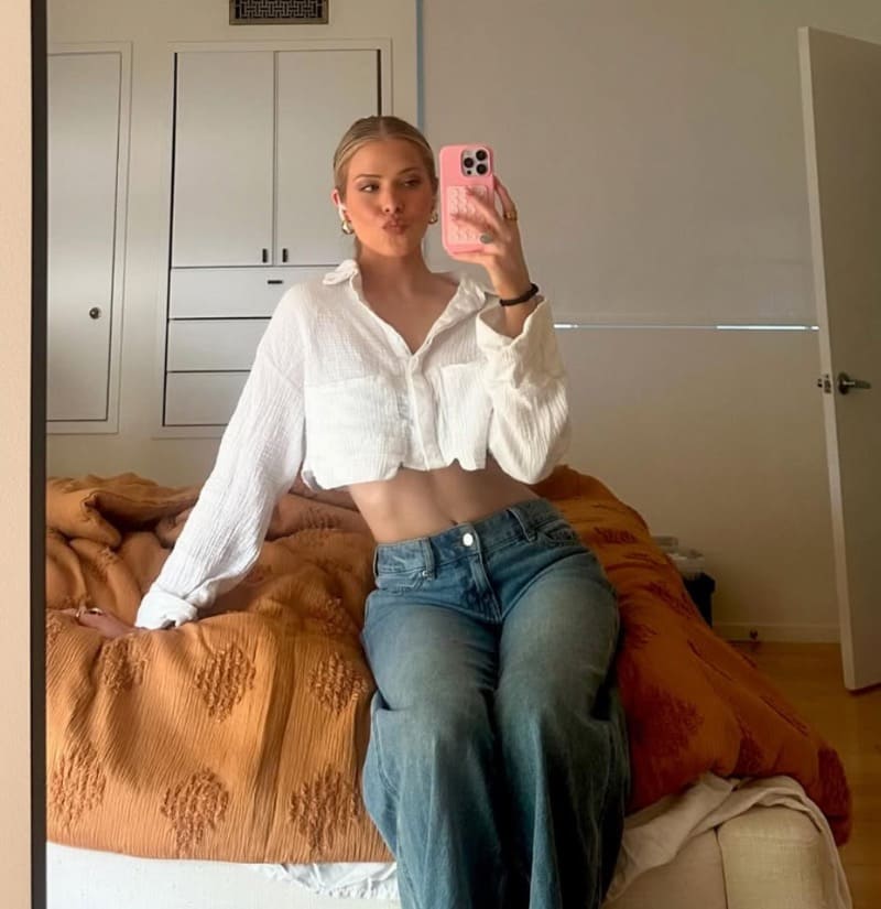 Sexy becca in jeans on a bed