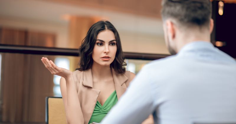 Woman manipulates man at dinner room