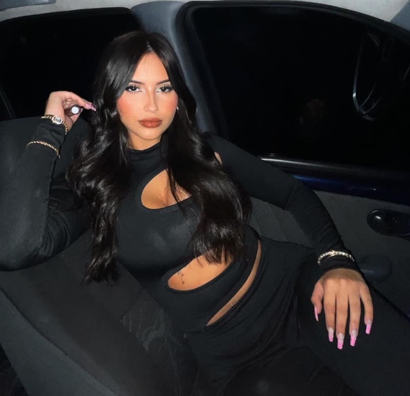 Brunette in car with dress