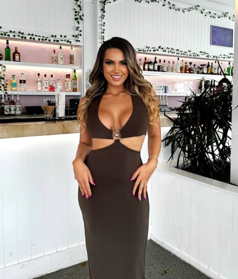 Lara in sexy brown dress
