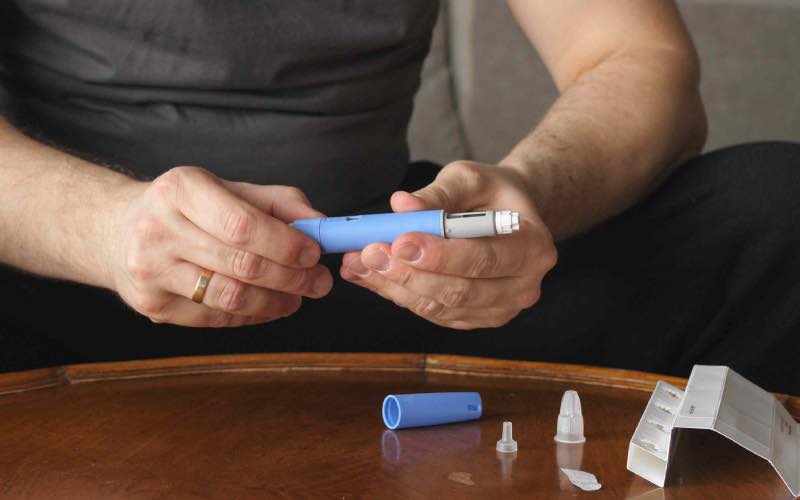 Person with Ozempic Pen