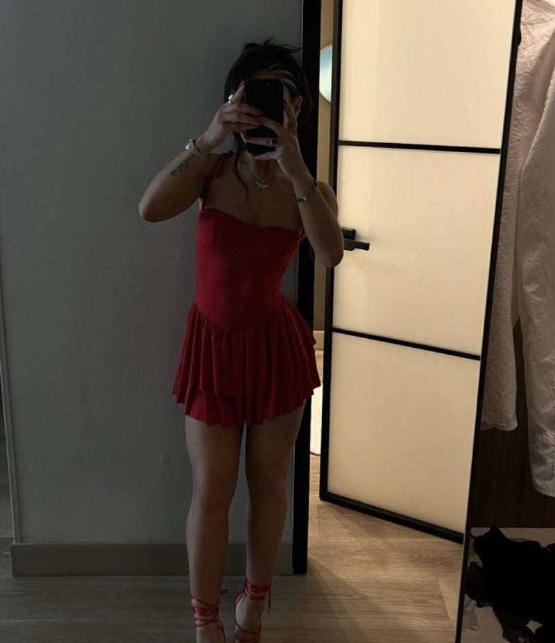 Delia in sexy outfit