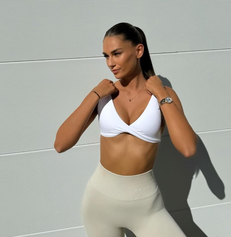 Sexy brunette in sport outfit