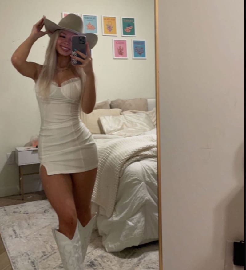 Breese in cowgirl outfit