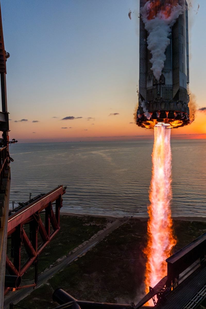 Booster rocket getting caught by launch tower. Credit: Friends of Nasa