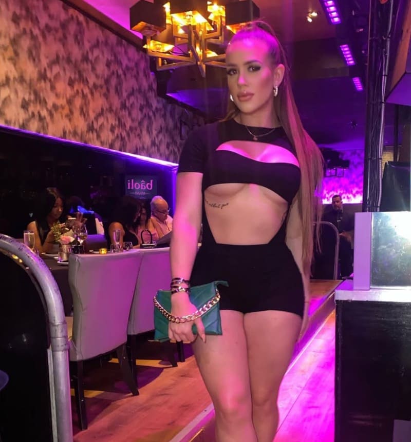 Sexy babe in party room