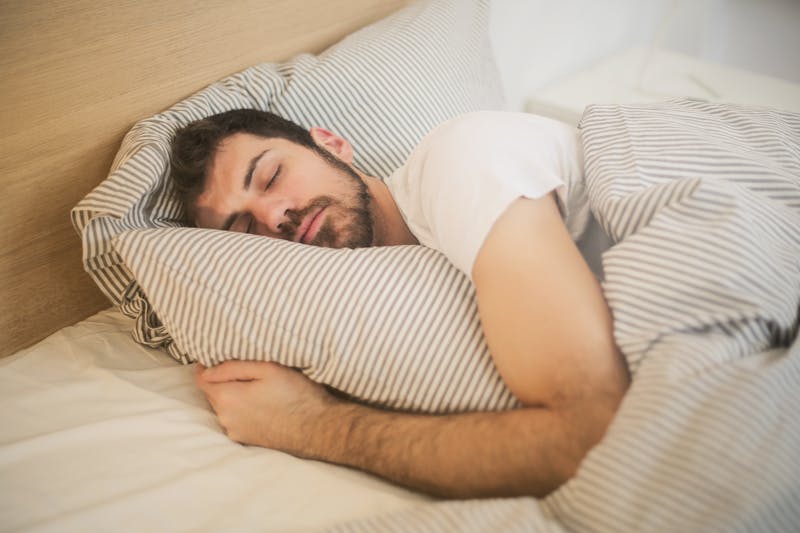 Man having sleep in bed