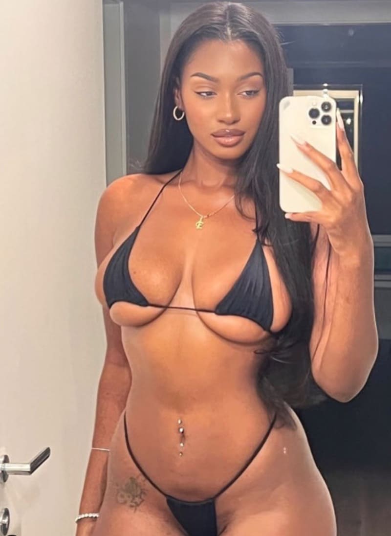 Elinda showing off massive tits in mini bikini