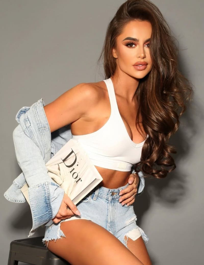 Sexy model with Dior book