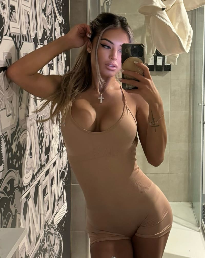 Babe in beige sport overall with nice big tits
