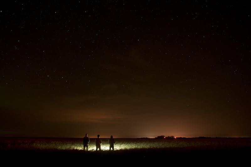 People standing with lanterns