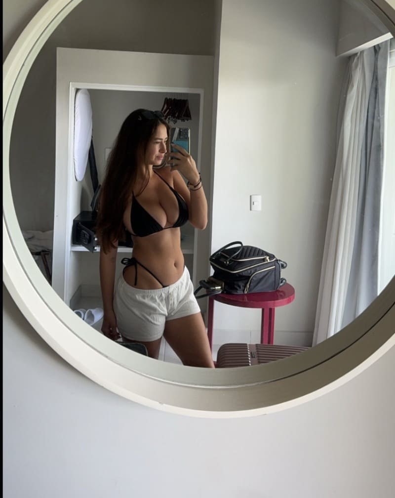 Babe with fit body taking mirror selfie