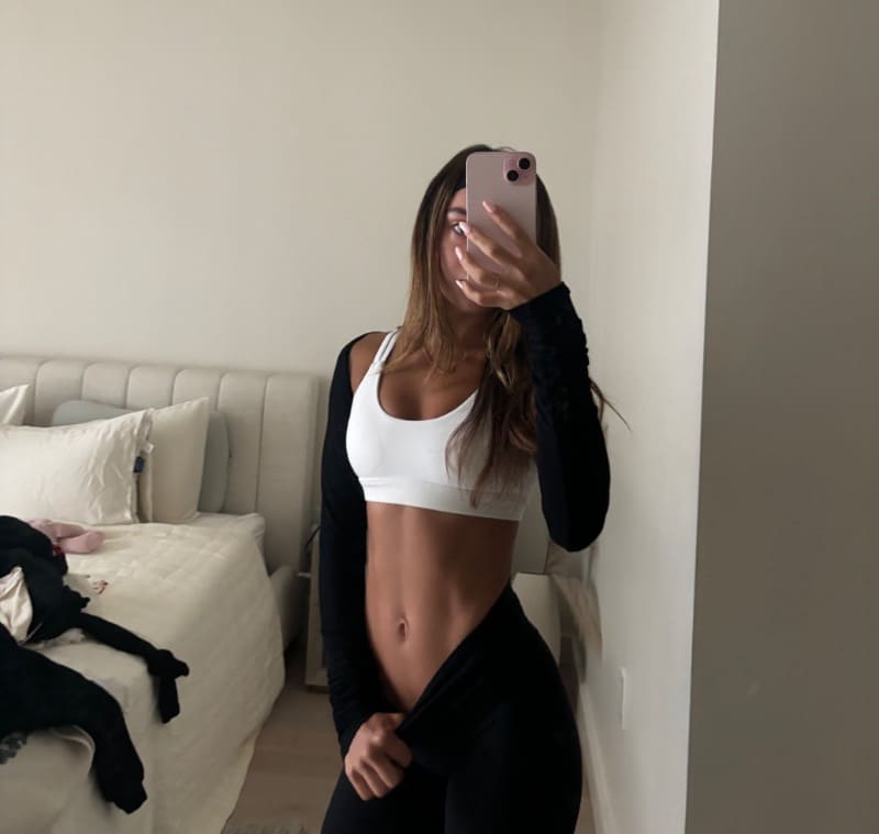 Mia showing off abs
