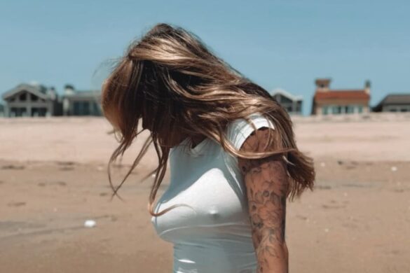 Sexy woman on beach in bikini and tight top