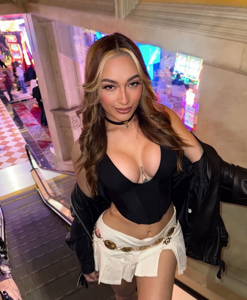 babe in black tight top with nice cleavage